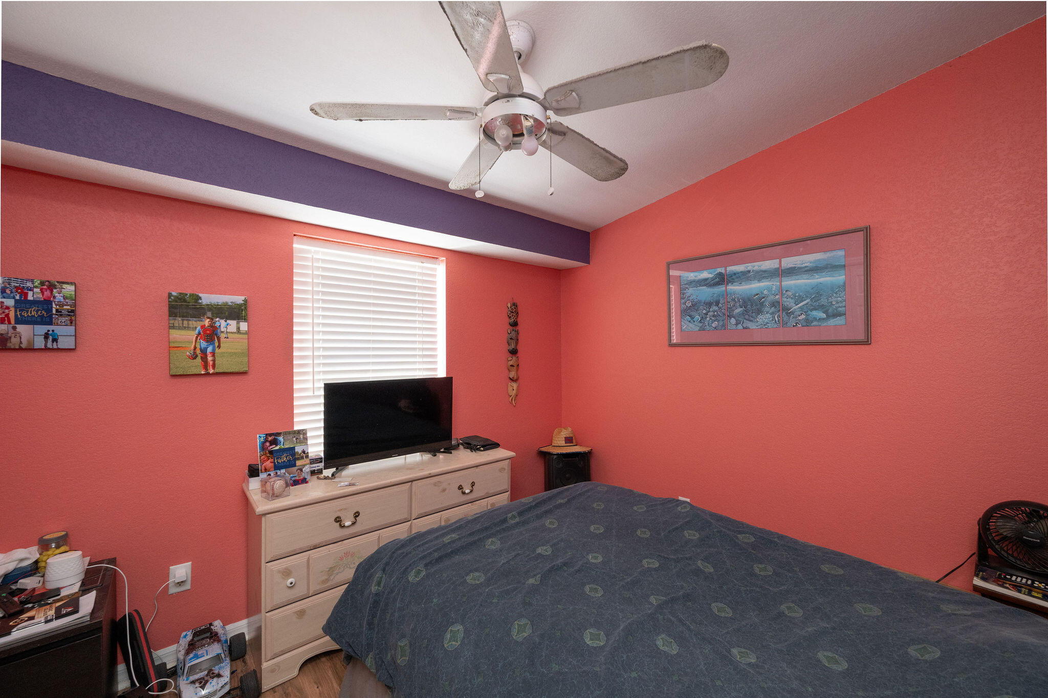 206 4th Street Key West, FL 33040 - Photo 16 of 44 a bedroom with a bed and a flat screen tv