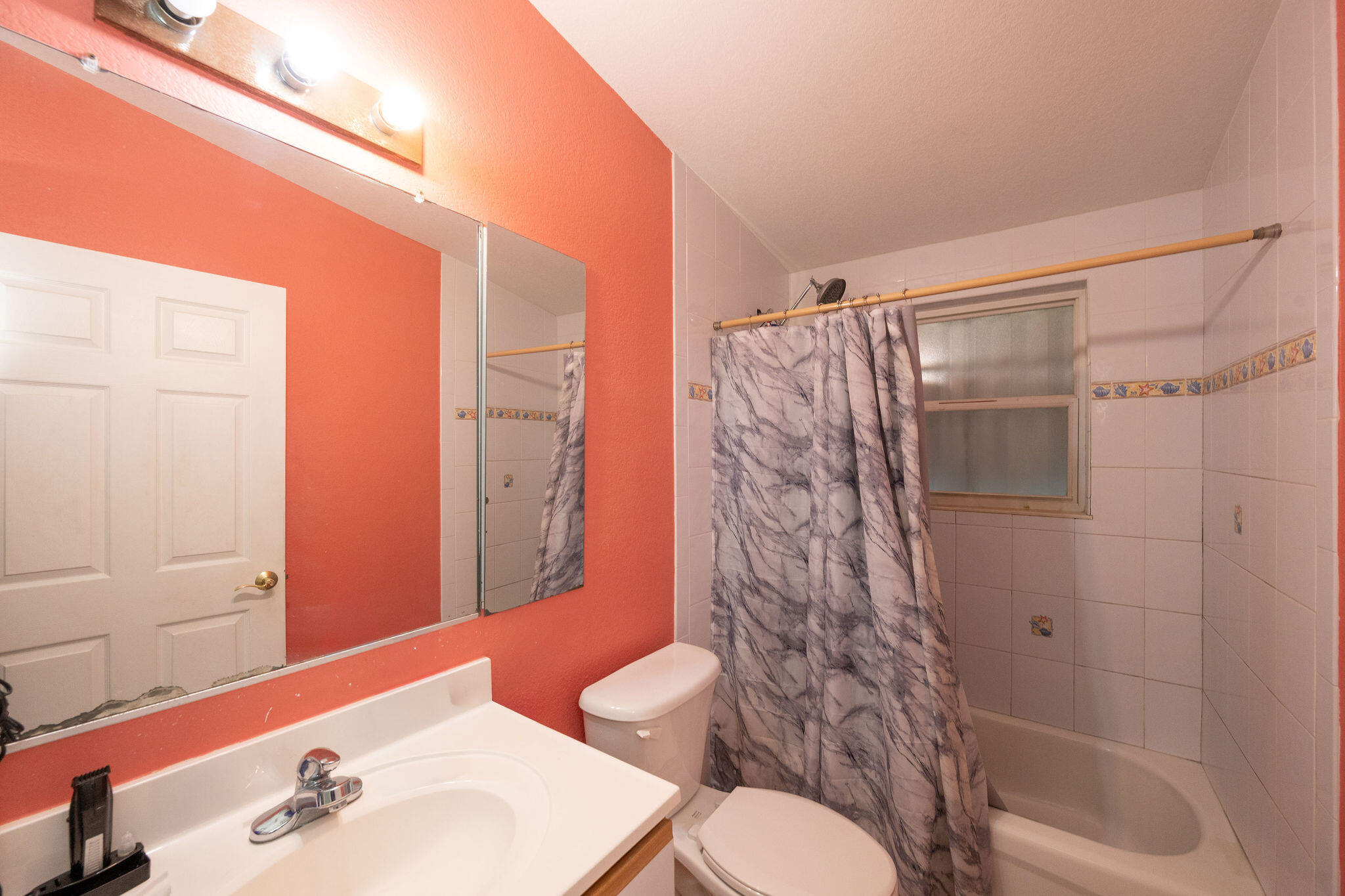 206 4th Street Key West, FL 33040 - Photo 17 of 44 a bathroom with a sink toilet and shower