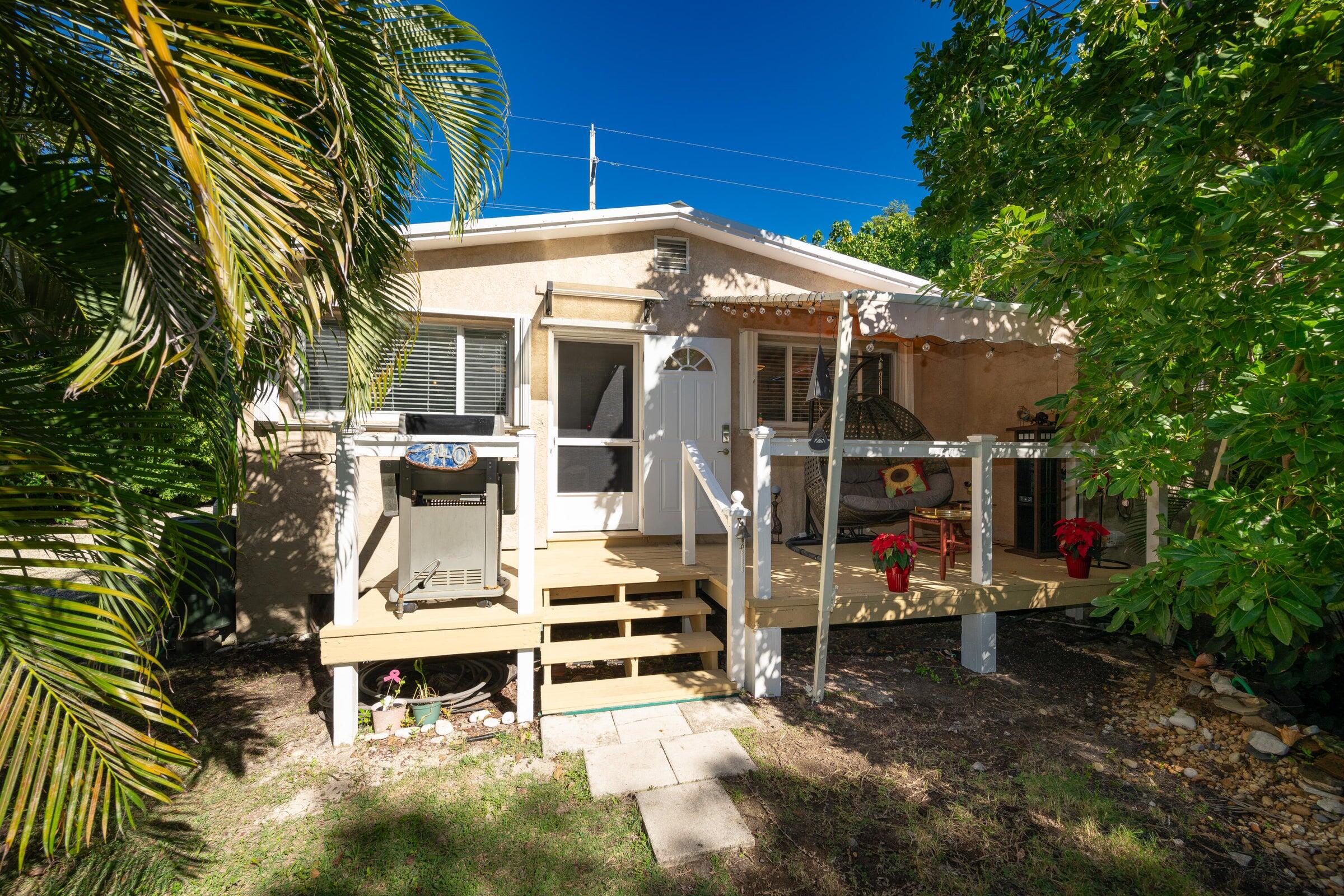 206 4th Street Key West, FL 33040 - Photo 20 of 44 a view of a chair and tables in the patio