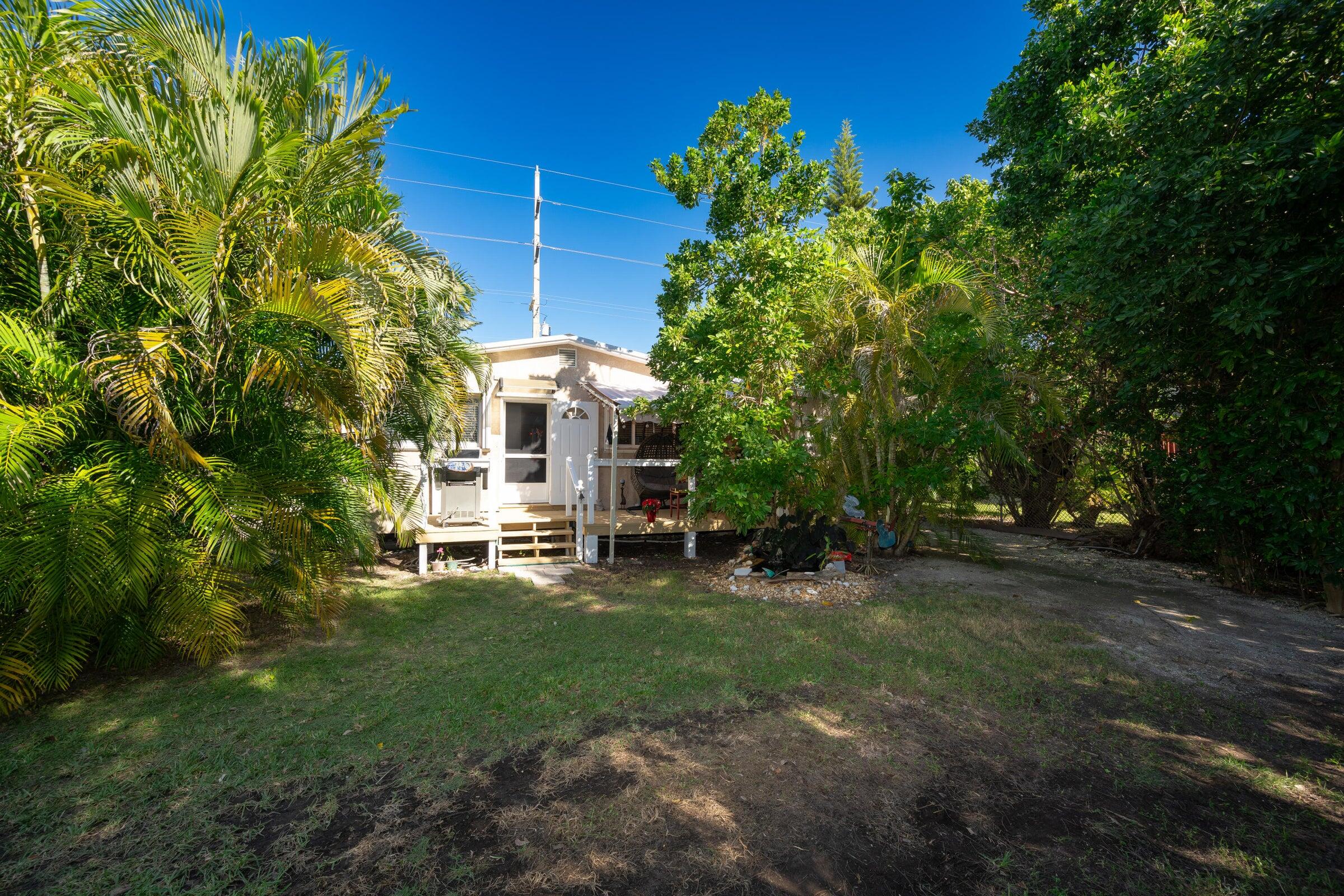 206 4th Street Key West, FL 33040 - Photo 21 of 44 a view of a house with a yard