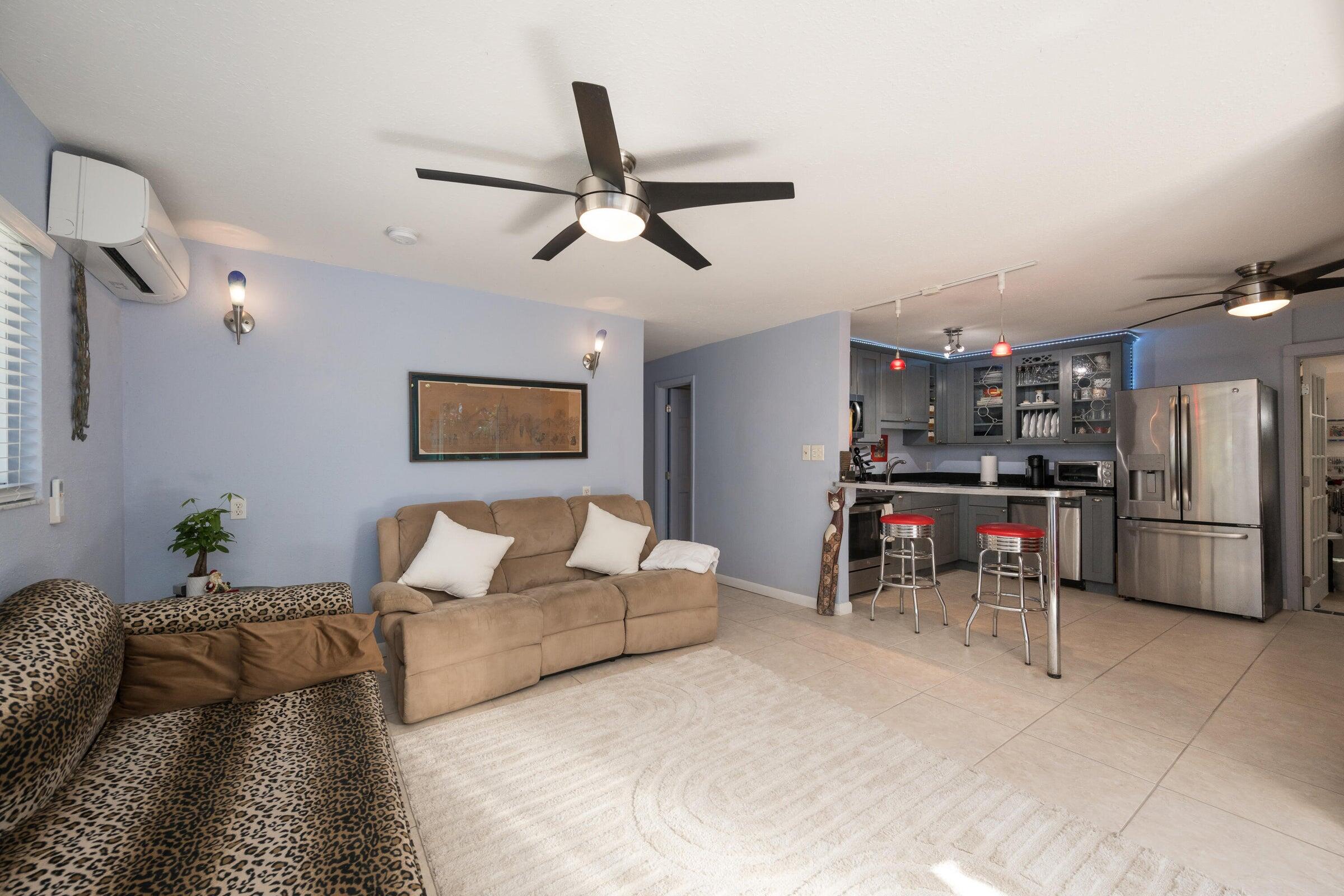 206 4th Street Key West, FL 33040 - Photo 25 of 44 a living room with furniture and kitchen view