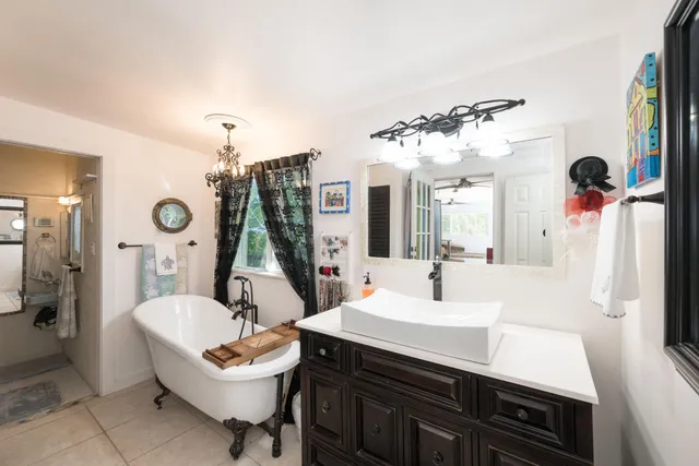 a bathroom with a shower curtain and a curtain