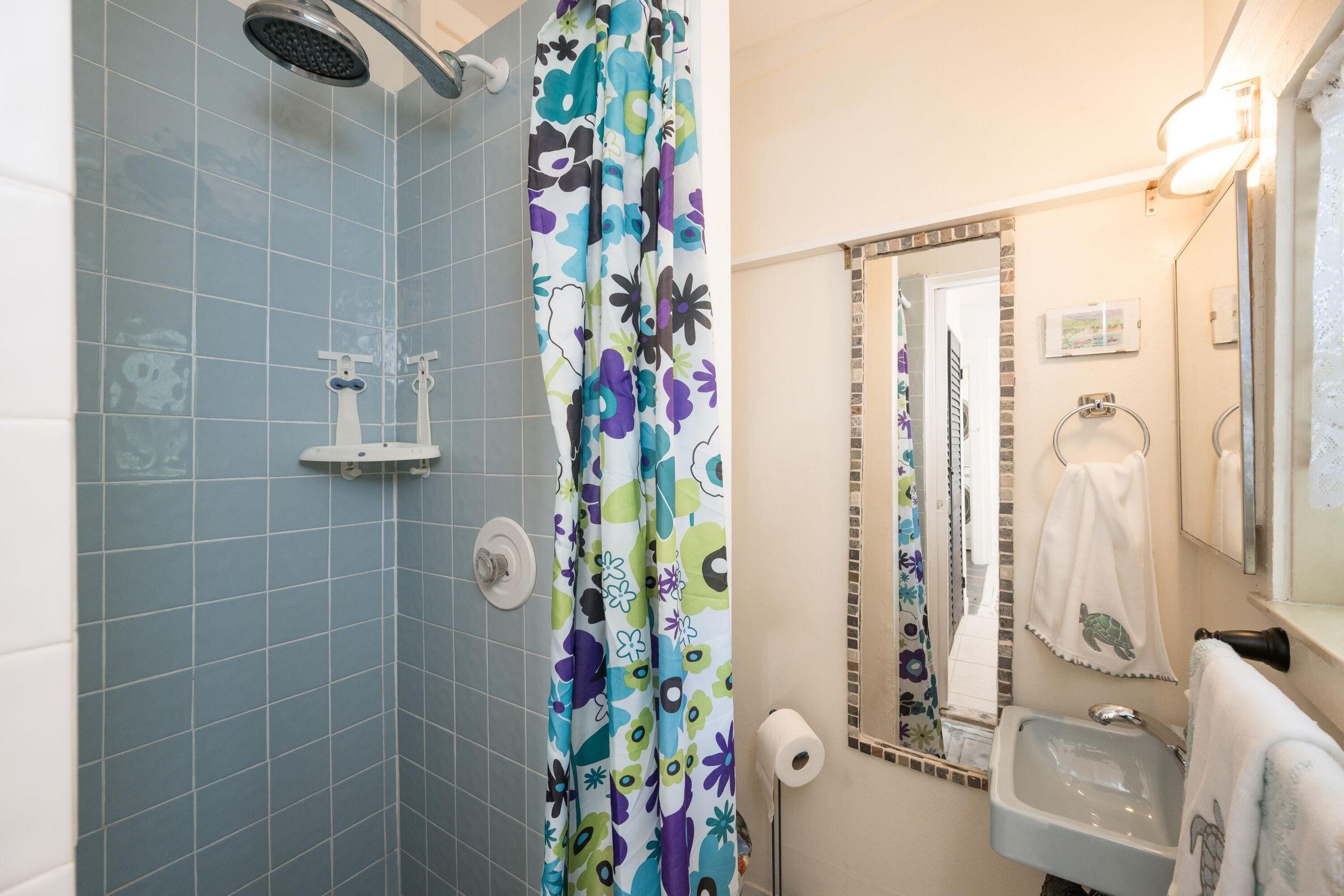 206 4th Street Key West, FL 33040 - Photo 30 of 44 a bathroom with a shower curtain and a curtain