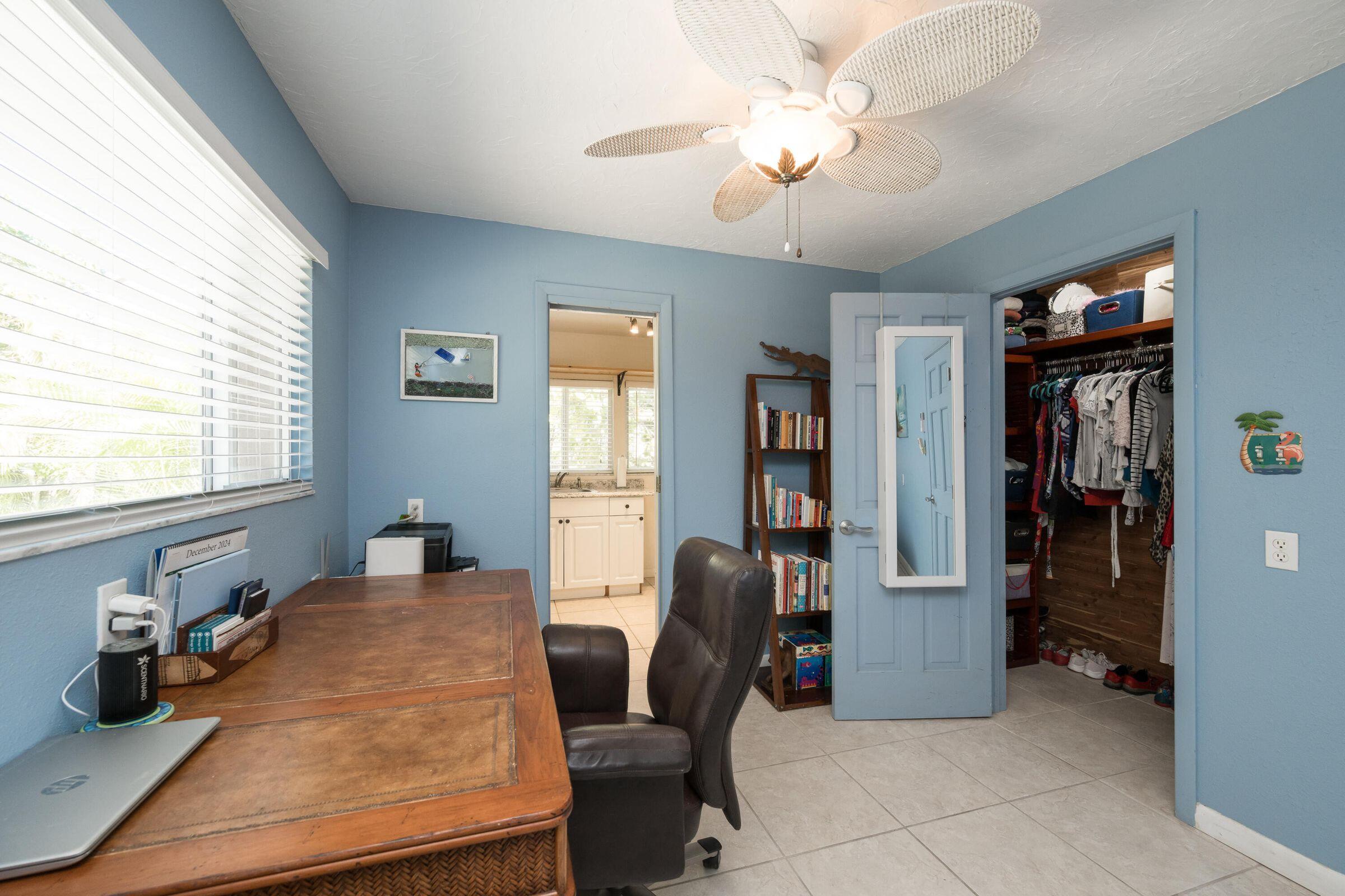 206 4th Street Key West, FL 33040 - Photo 34 of 44 a view of a workspace with furniture and a window