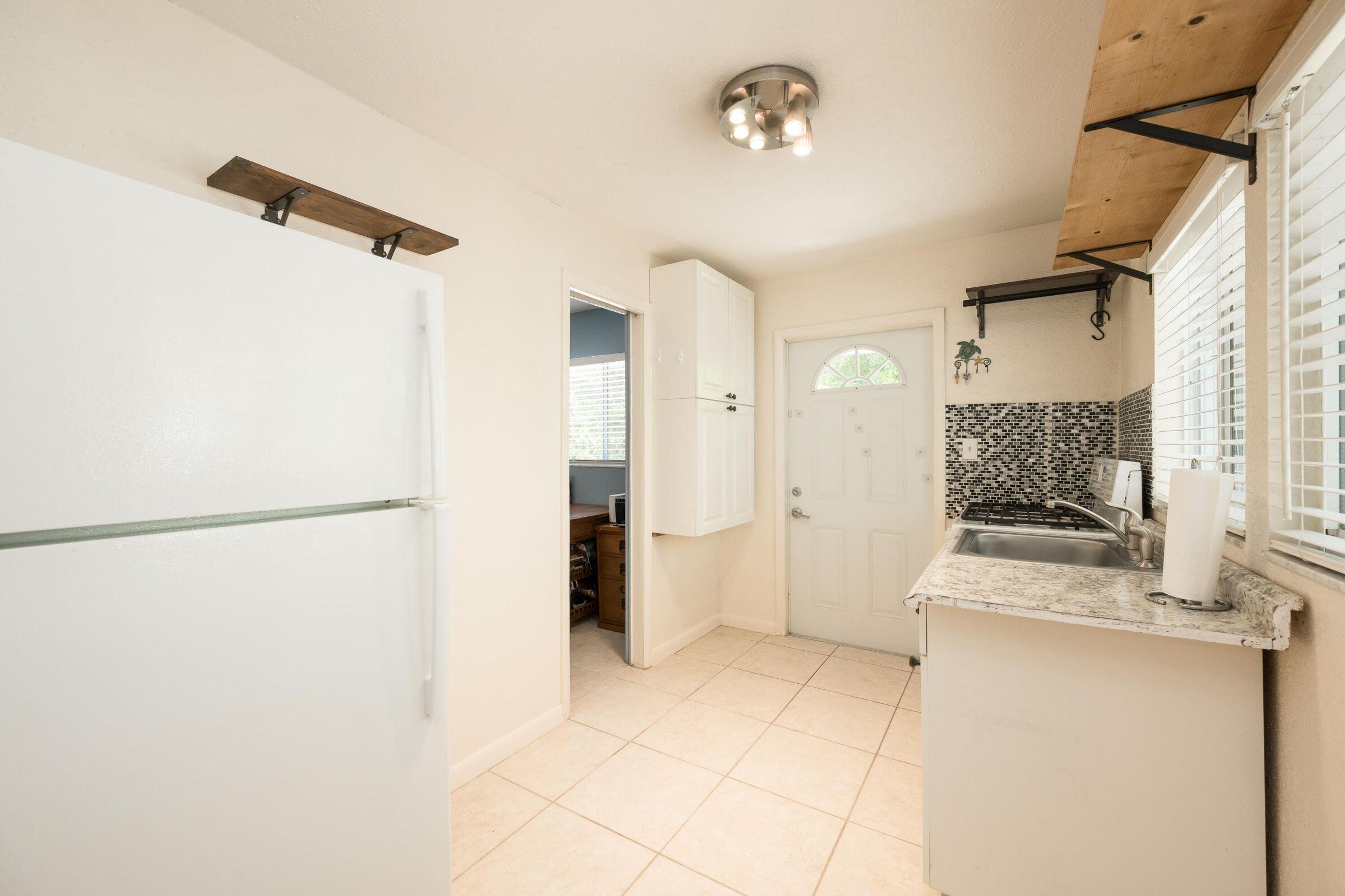 206 4th Street Key West, FL 33040 - Photo 37 of 44 a bathroom with a shower and a mirror