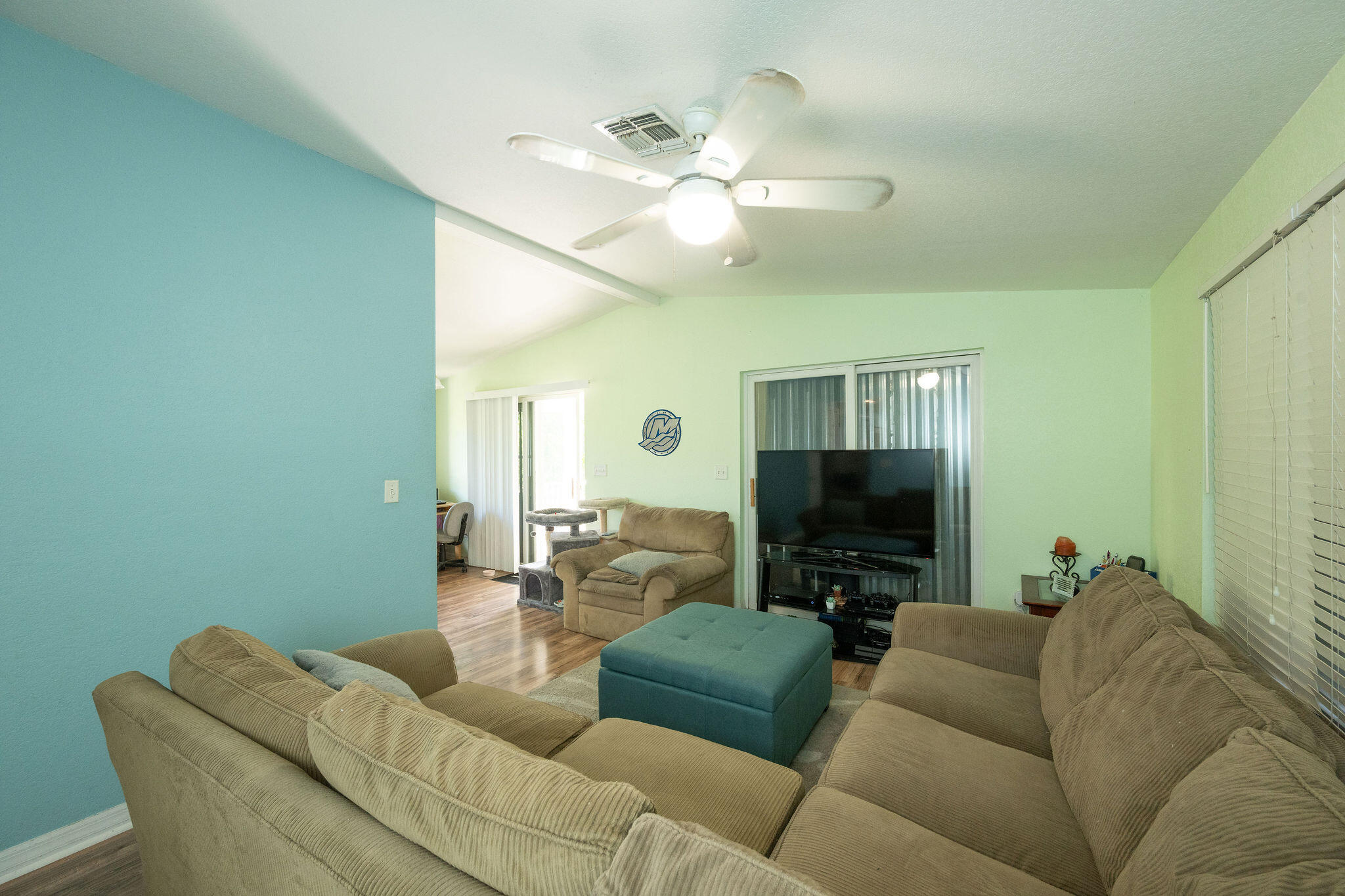 206 4th Street Key West, FL 33040 - Photo 4 of 44 a living room with furniture and a flat screen tv