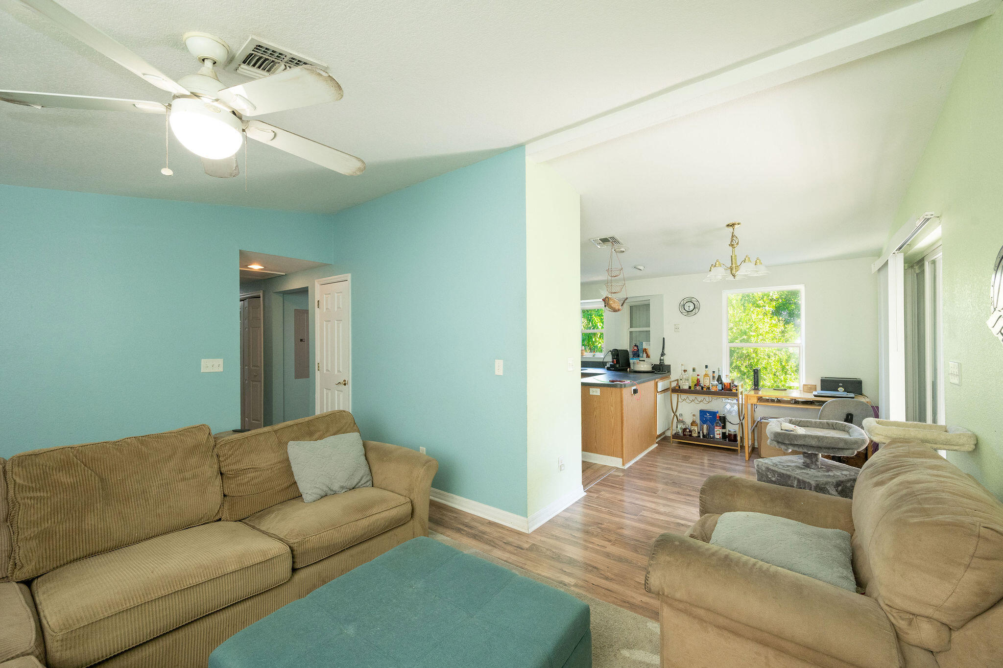 206 4th Street Key West, FL 33040 - Photo 5 of 44 a living room with furniture and a chandelier