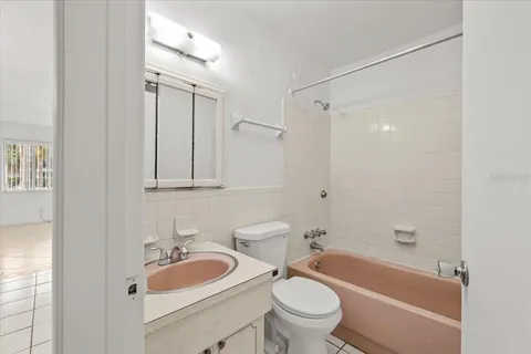 an empty room with fan and ceiling fan