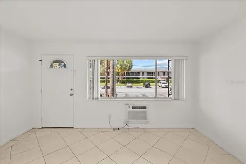 a kitchen with cabinets and white appliances