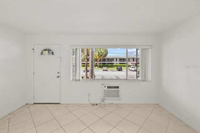 a kitchen with cabinets and white appliances