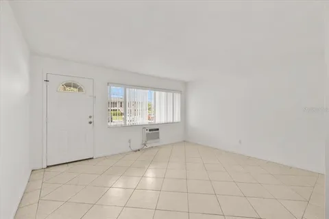 a kitchen with a sink a stove and cabinets