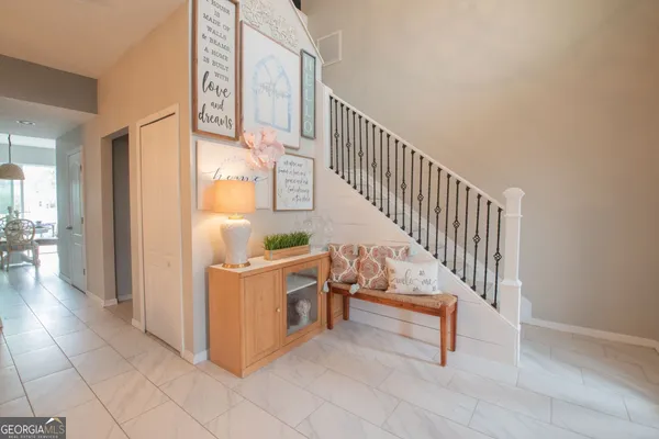 a view of a hallway with seating area