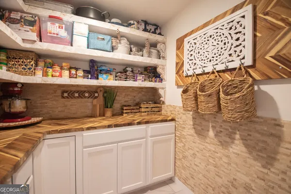 a kitchen with stainless steel appliances granite countertop a sink and cabinets