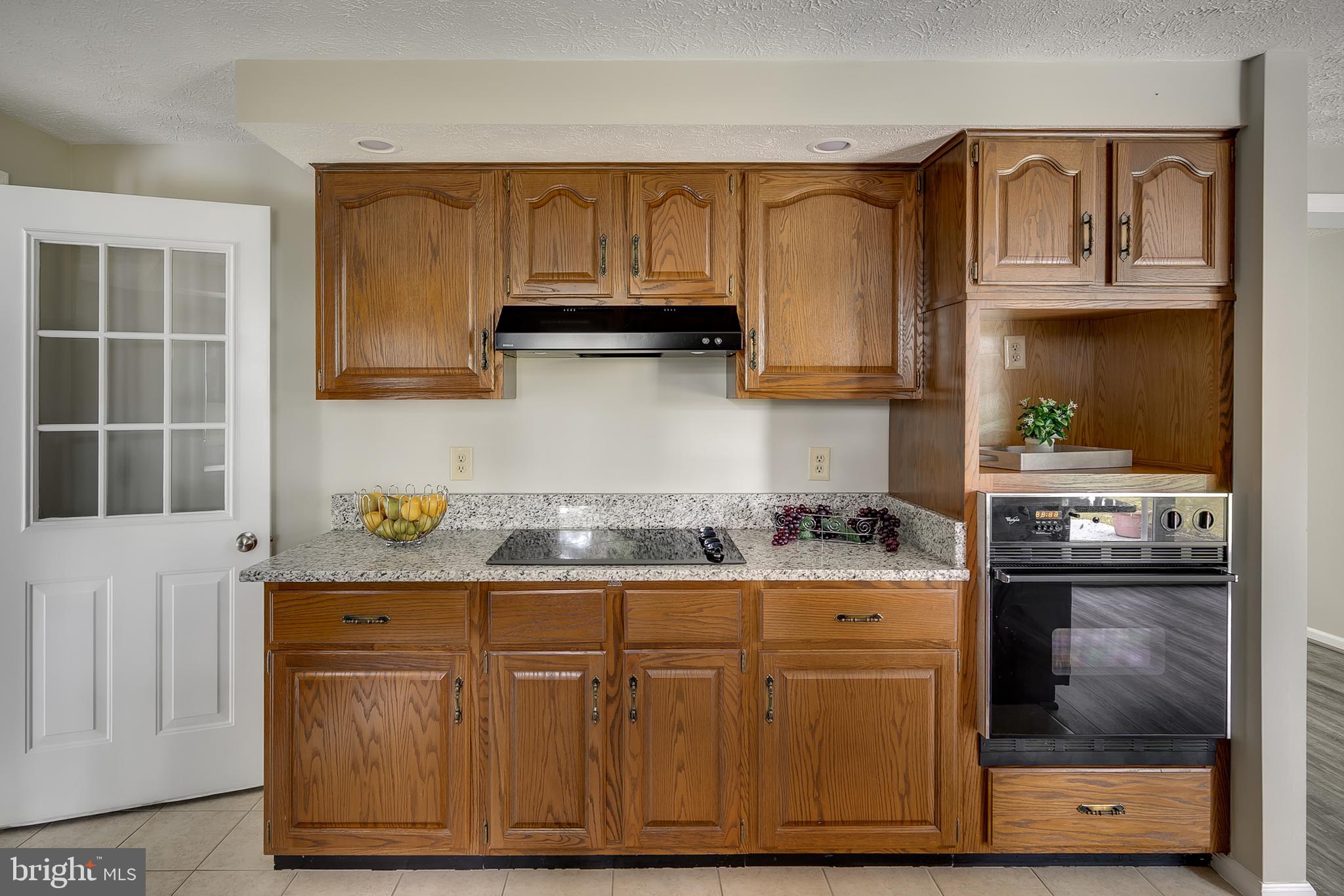 1504 New Hope Road Cross Junction, VA 22625 - Photo 8 of 35 a kitchen with granite countertop cabinets and steel stainless steel appliances