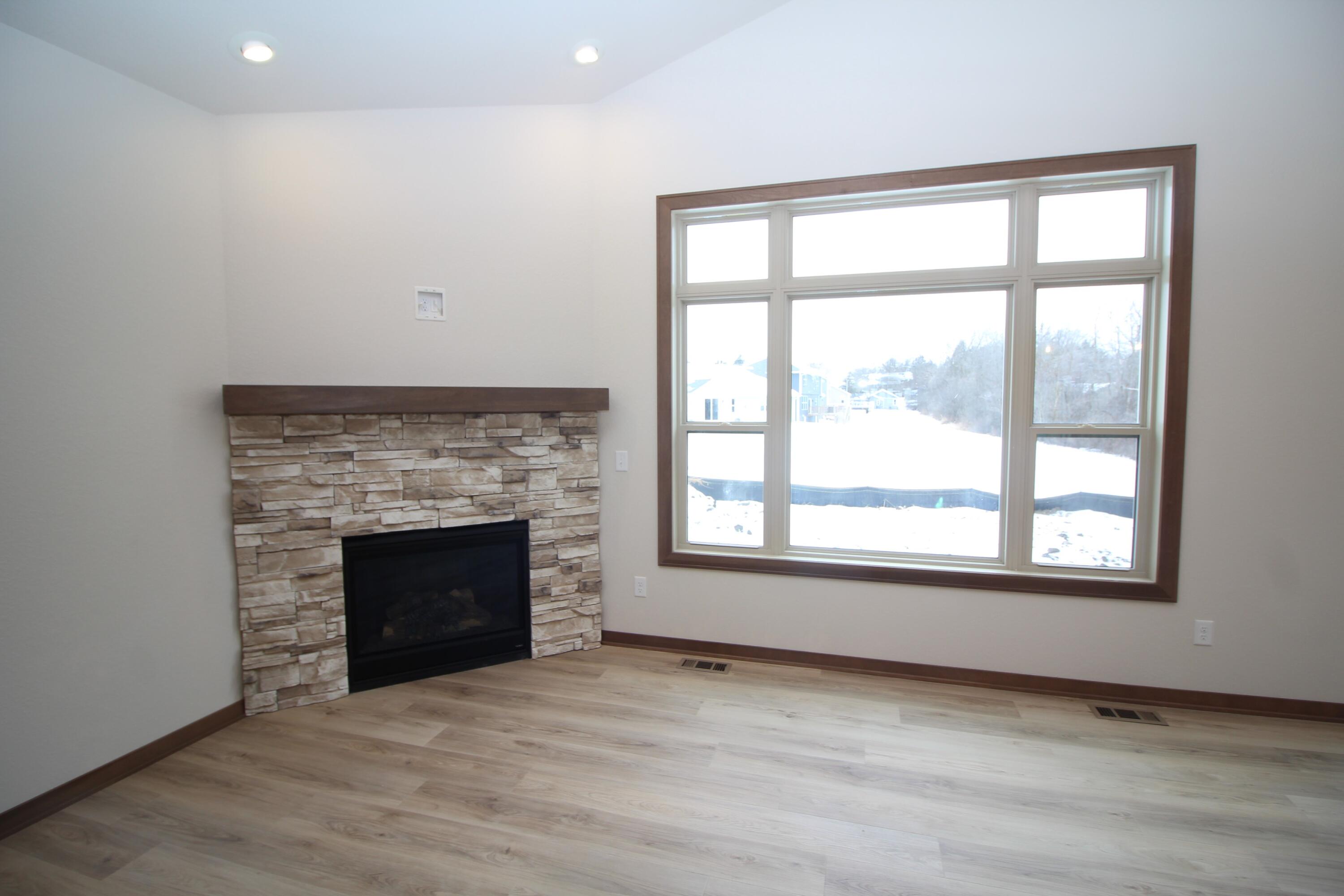 522 Calvin Lane Mount Pleasant, WI 53406 - Photo 12 of 23 Natural gas corner fireplace