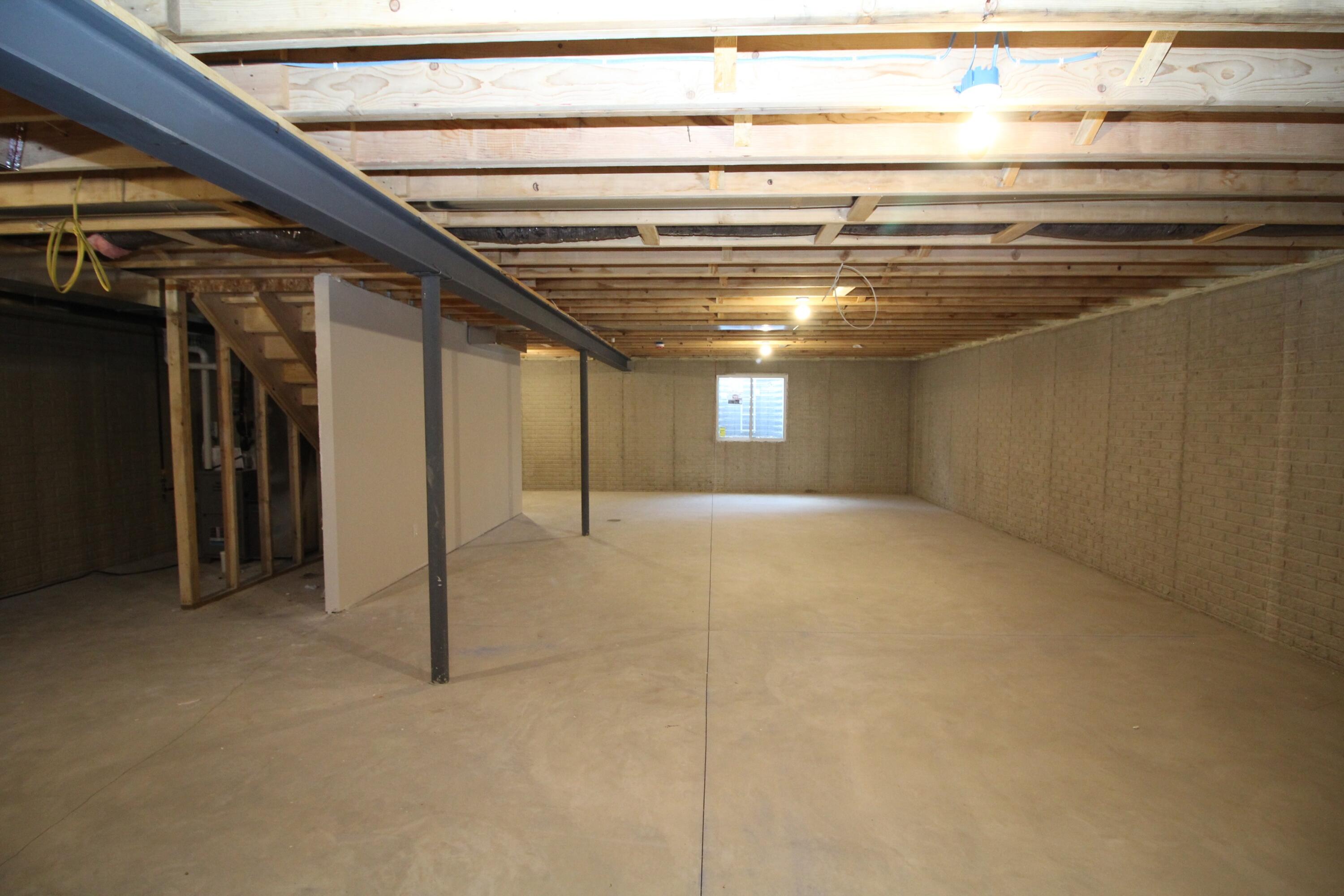 522 Calvin Lane Mount Pleasant, WI 53406 - Photo 22 of 23 Basement with egress window and stubbed for a possible future bath