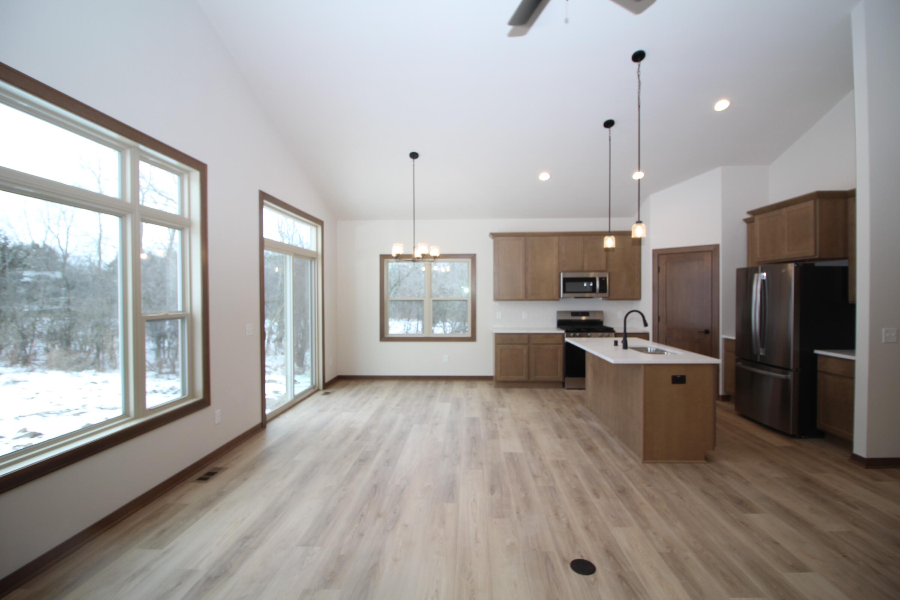 522 Calvin Lane Mount Pleasant, WI 53406 - Photo 4 of 23 Great room, dinette and kitchen