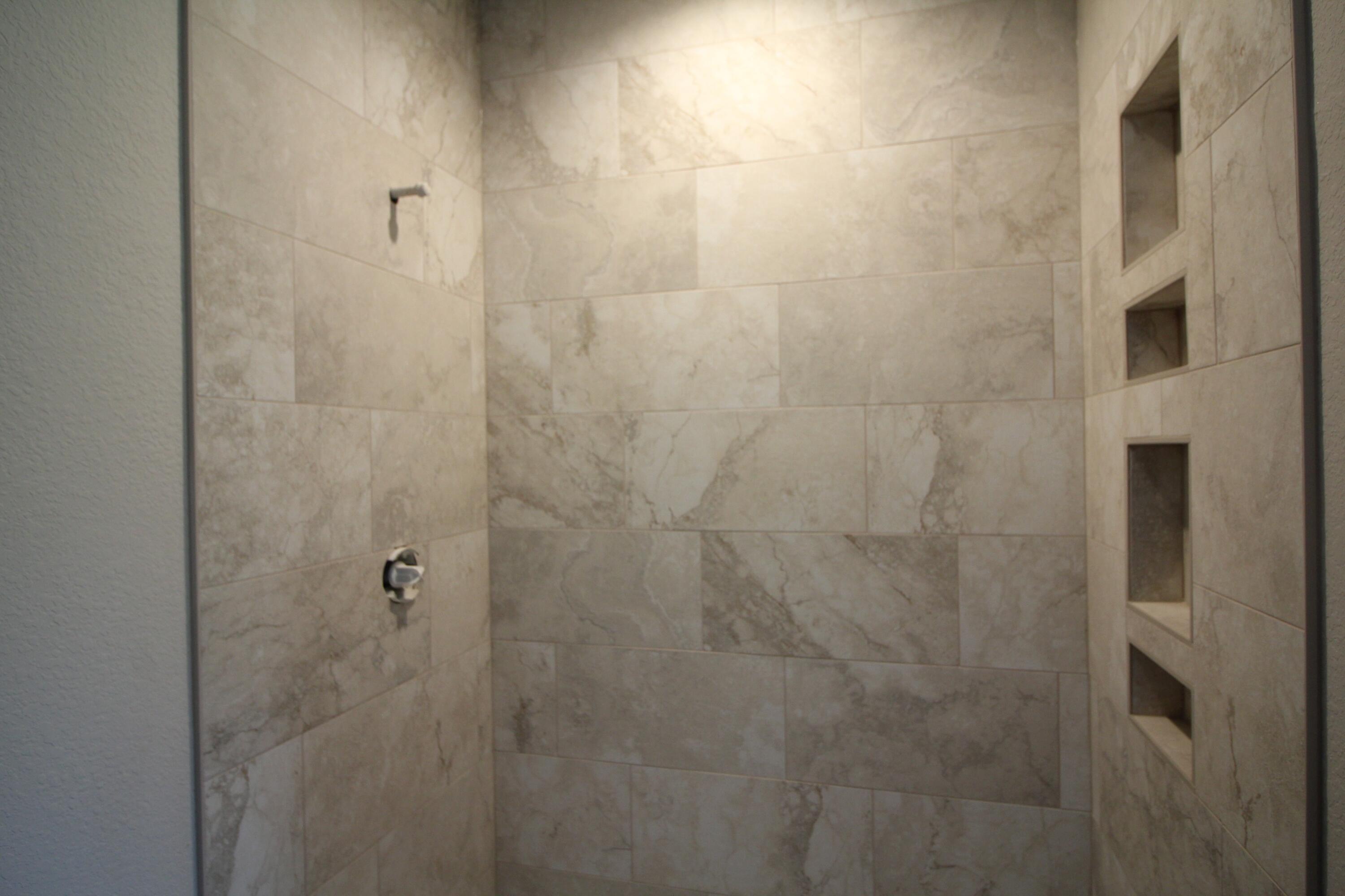522 Calvin Lane Mount Pleasant, WI 53406 - Photo 5 of 10 New construction in progress: ceramic tile shower in master bath