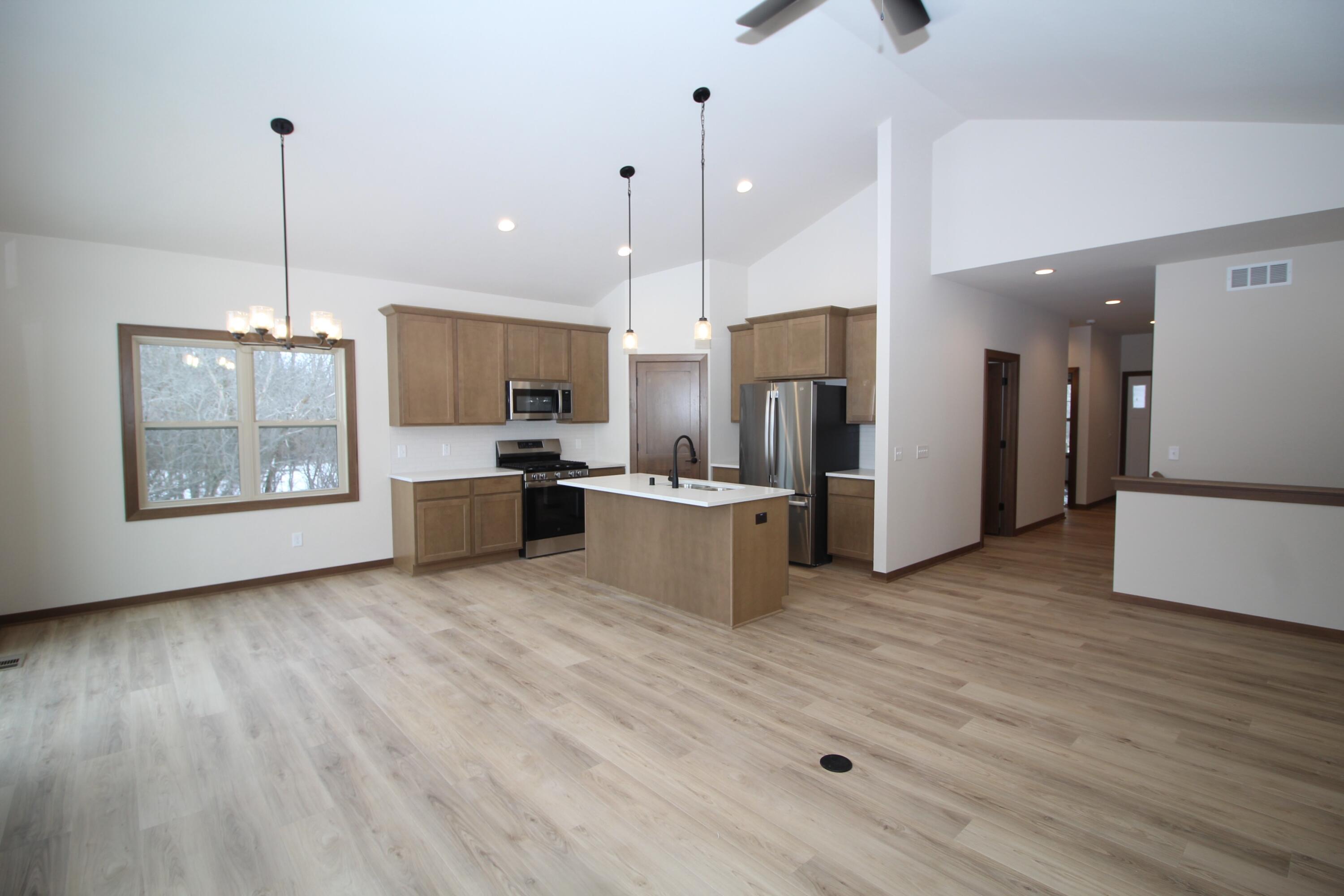 522 Calvin Lane Mount Pleasant, WI 53406 - Photo 6 of 23 Great room with in floor outlet