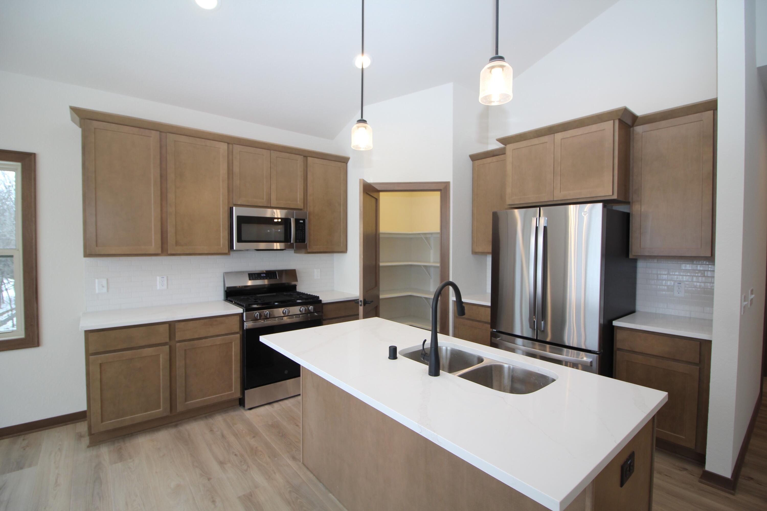 522 Calvin Lane Mount Pleasant, WI 53406 - Photo 7 of 23 Quartz countertops and Kohler plumbing fixtures