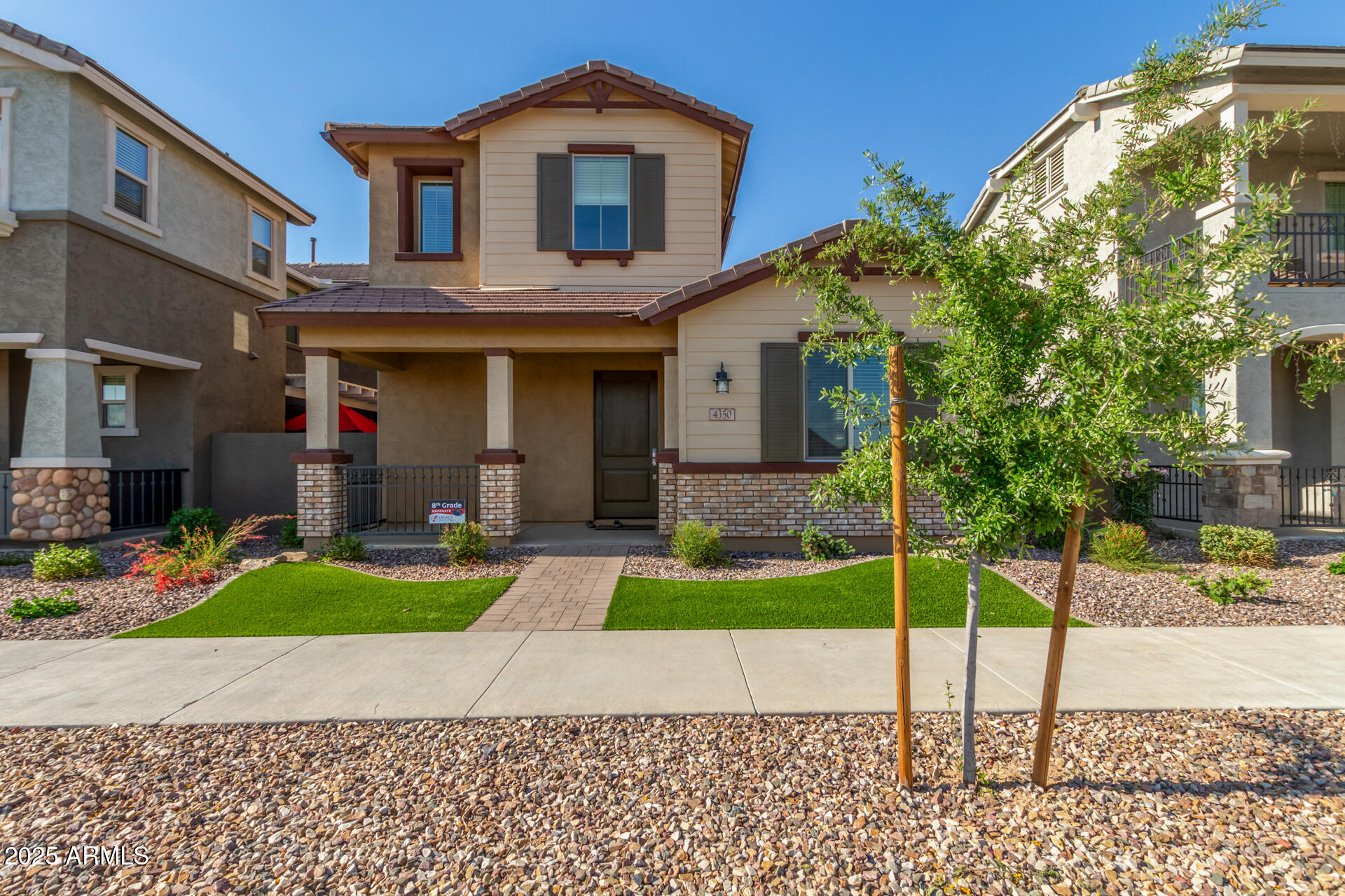 4350 East Jesse Street Gilbert, AZ 85295 - Photo 1 of 1 a front view of a house with a yard and potted plants