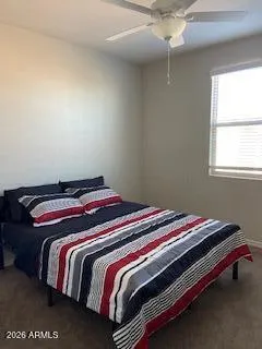 a bedroom with a bed and window