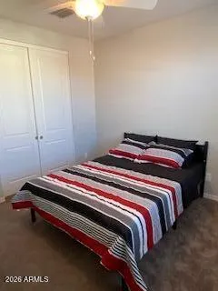 a bedroom with bed and a window