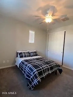 a bed sitting in a bedroom next to a window