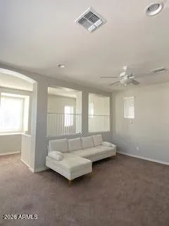 a living room with furniture and windows