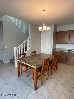 a dining room with a table and chairs