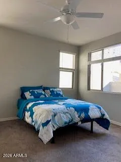 a bedroom with a bed and window