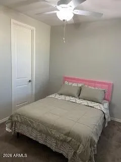 a bedroom with a bed and chandelier