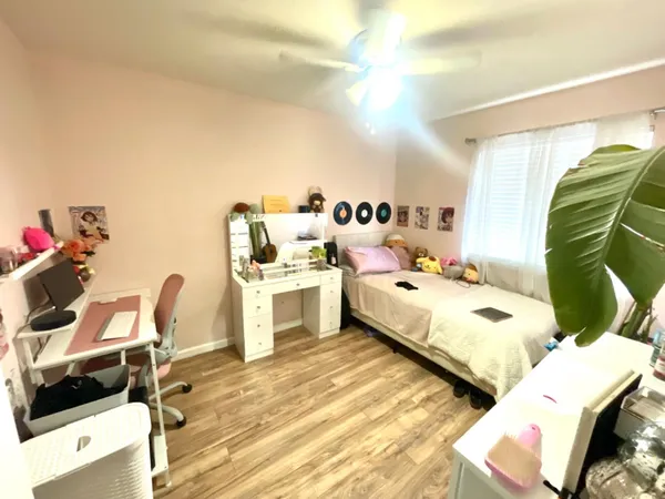 a bed room with a bed and a chair