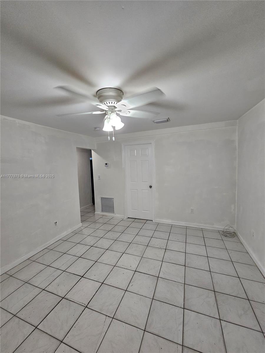 330 Southwest 79th Court, Unit 2 Miami, FL 33144 - Photo 2 of 9 a view of an empty room and window