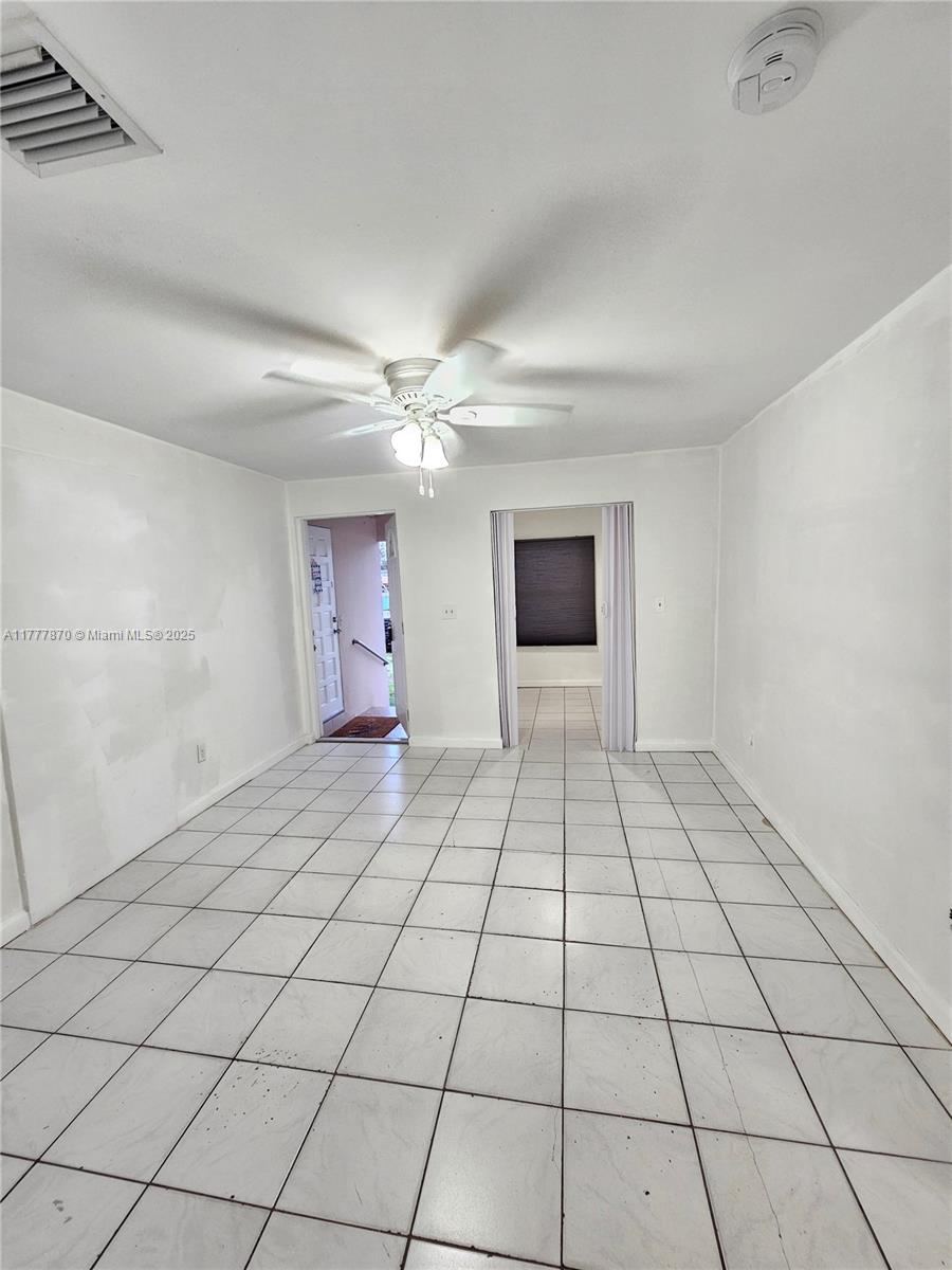 330 Southwest 79th Court, Unit 2 Miami, FL 33144 - Photo 8 of 9 a view of an empty room and window