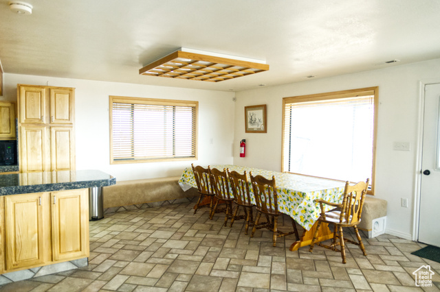 588 Raspberry Patch Road Garden City, UT 84028 - Photo 33 of 74 Dining room featuring brick patterned flooring and baseboards