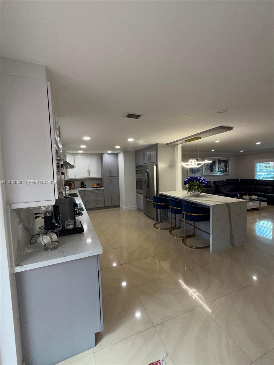 10550 Southwest 51st Street Cooper City, FL 33328 - Photo 14 of 37 a room with furniture and a table