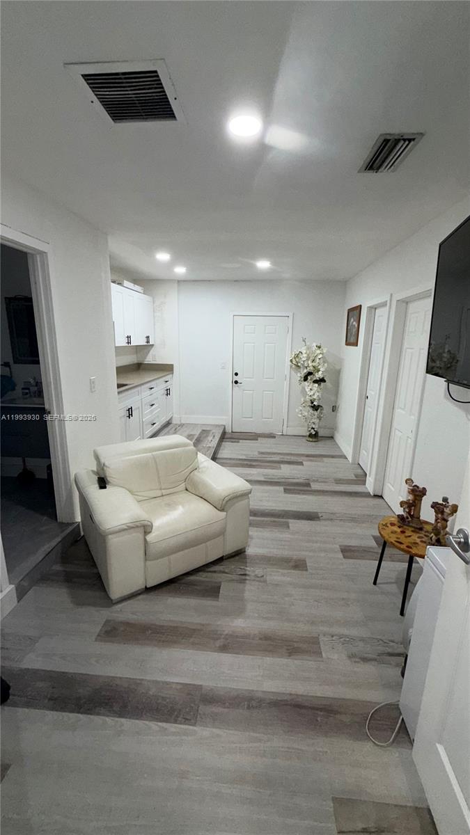 10550 Southwest 51st Street Cooper City, FL 33328 - Photo 25 of 37 a living room with furniture and a flat screen tv