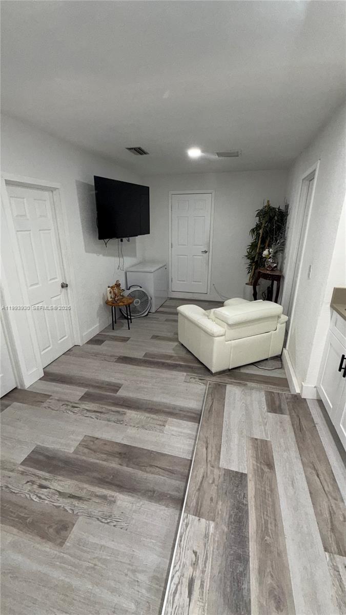 10550 Southwest 51st Street Cooper City, FL 33328 - Photo 26 of 37 a bedroom with a bed and flat screen tv