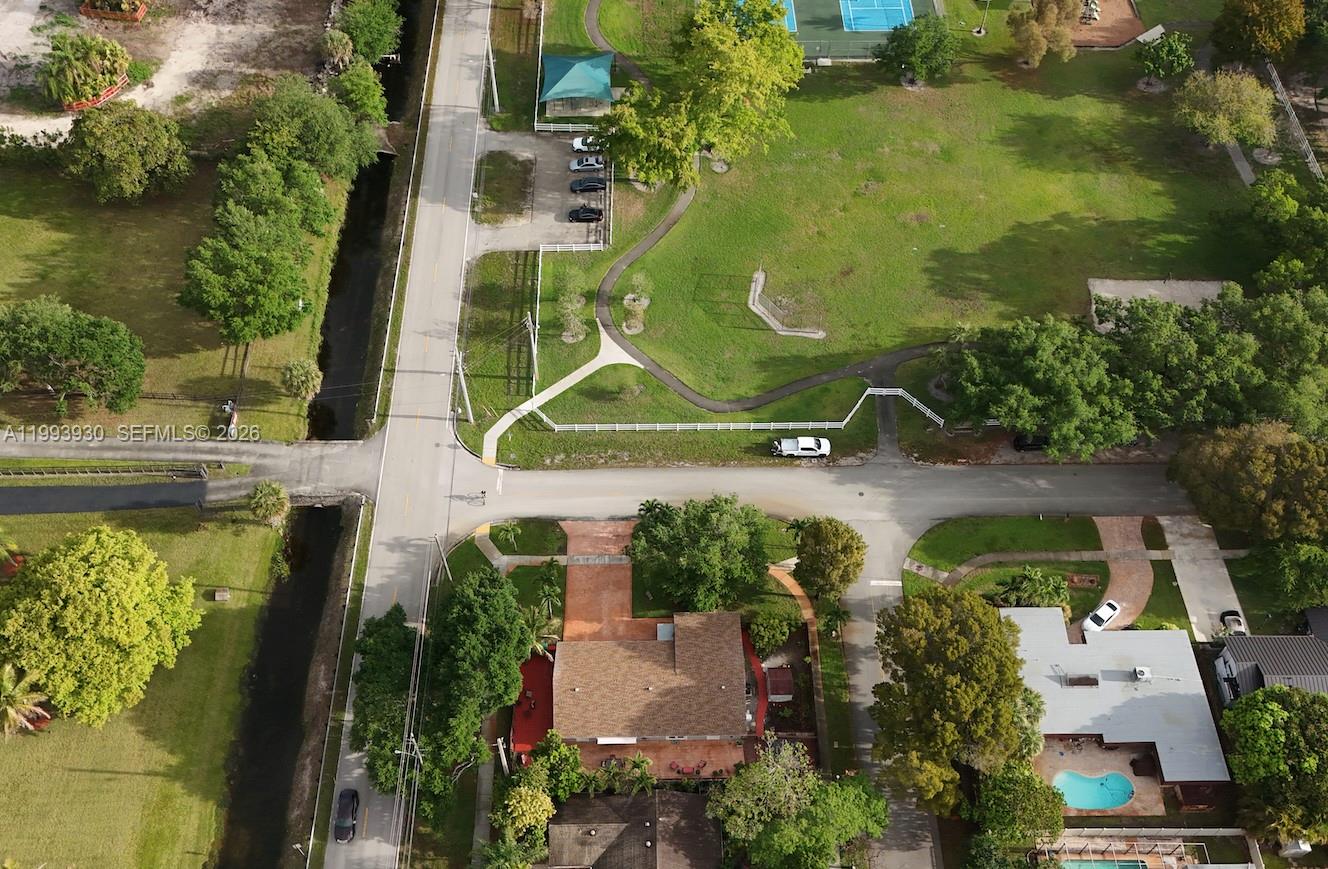 10550 Southwest 51st Street Cooper City, FL 33328 - Photo 5 of 37 an aerial view of a house with swimming pool and large trees
