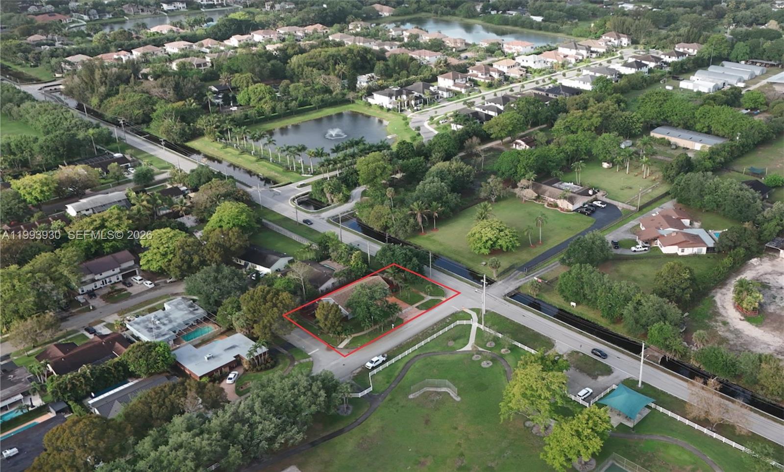 10550 Southwest 51st Street Cooper City, FL 33328 - Photo 8 of 37 an aerial view of a residential houses with a lush green forest
