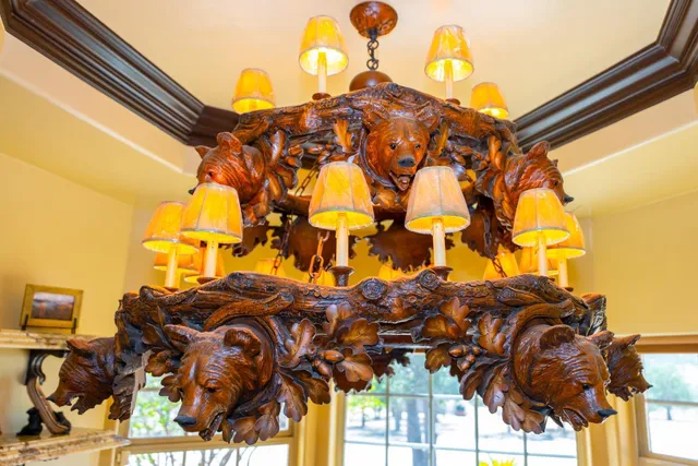 a bathroom with a granite countertop sink and a large mirror