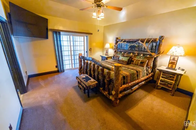 a view of a room with wooden floor and staircase
