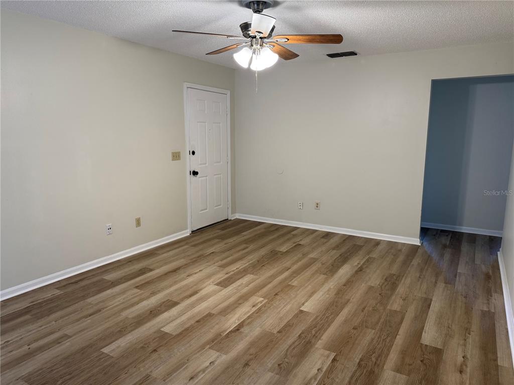 513 Green Spring Circle Winter Springs, FL 32708 - Photo 3 of 12 wooden floor in an empty room