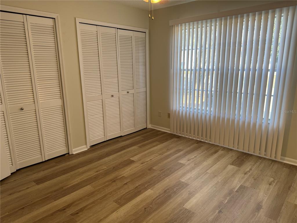 513 Green Spring Circle Winter Springs, FL 32708 - Photo 6 of 12 a view of a room with wooden floor and windows