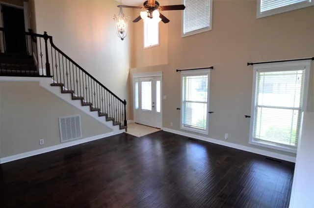 a view of an entryway with wooden floor