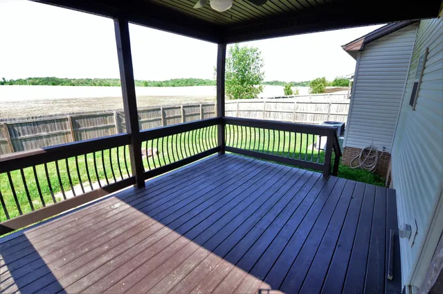 a view of a balcony with wooden floor