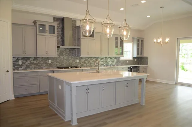 a bathroom with a sink vanity granite and a mirror