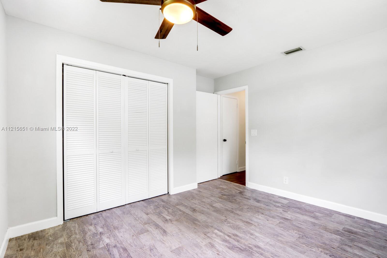 1515 Seabrook Road Jupiter, FL 33469 - Photo 18 of 29 a view of empty room with wooden floor