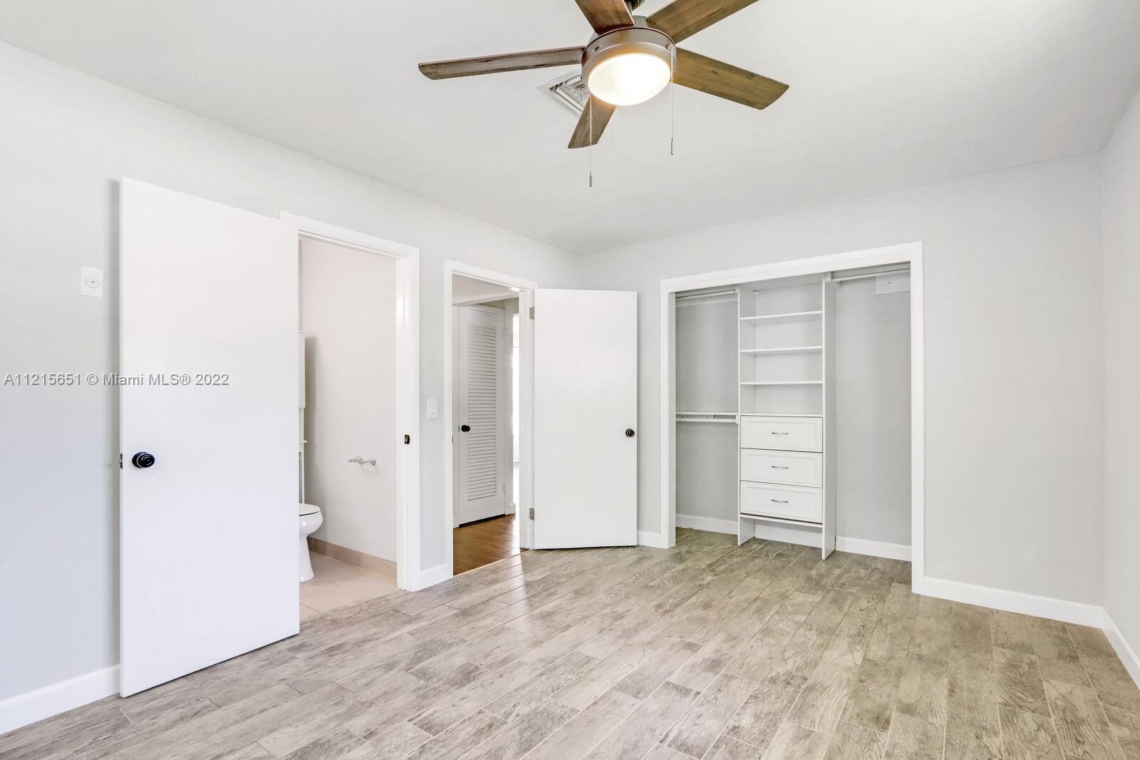 1515 Seabrook Road Jupiter, FL 33469 - Photo 19 of 29 a view of empty room with wooden floor